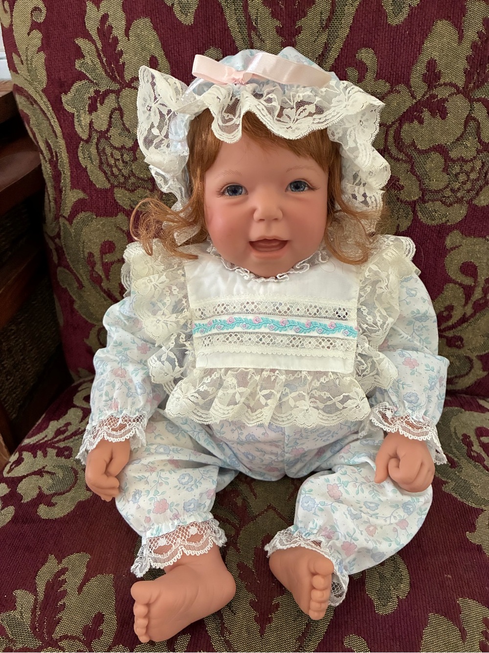 Heirloom-Style Baby Doll in White Lace Outfit with Pink Ribbon